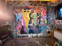 a painting in a studio with a lot of paint on it