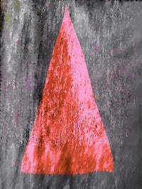 a red triangle on a black background