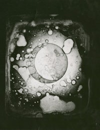 a black and white photo of a square with bubbles in it