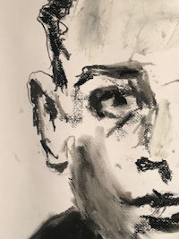 a black and white drawing of a man's face