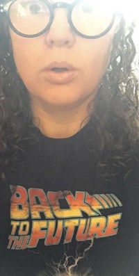 a woman wearing a back to the future t - shirt