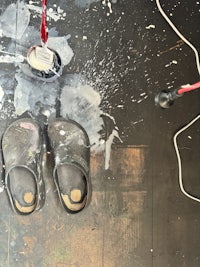 a pair of clogs on a wooden floor