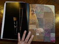 a person holding a book with a picture of a person holding a crutch