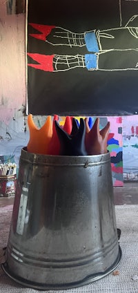 a bucket with a lot of different colored toys in it