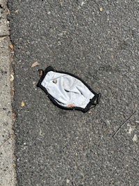 a face mask laying on the ground